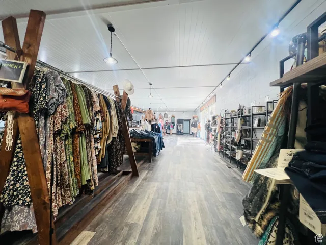 Interior space with brick wall and wood finished floors