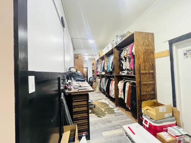 Walk in closet featuring wood finished floors