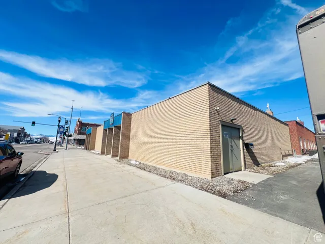 View of home's exterior featuring brick siding