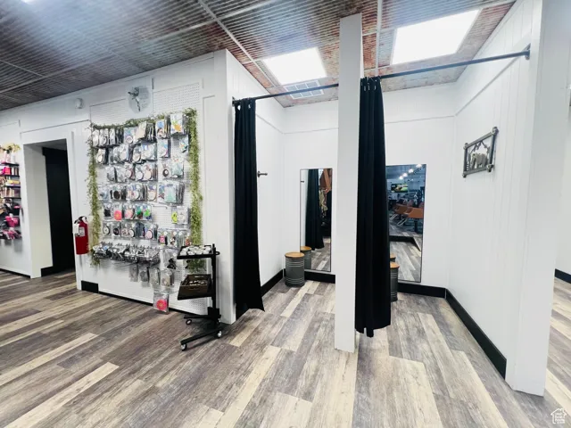 Interior space with wood finished floors and baseboards