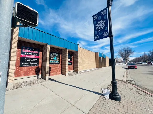 Exterior space featuring brick siding