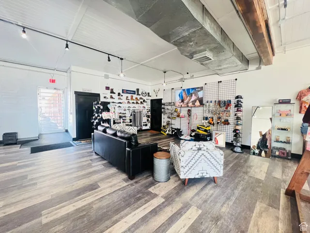 Living area with wood finished floors and visible vents