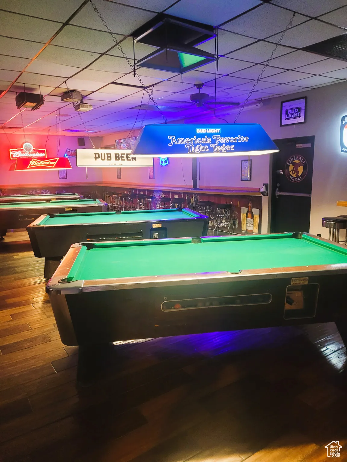 Recreation room featuring a drop ceiling, billiards, and wood finished floors