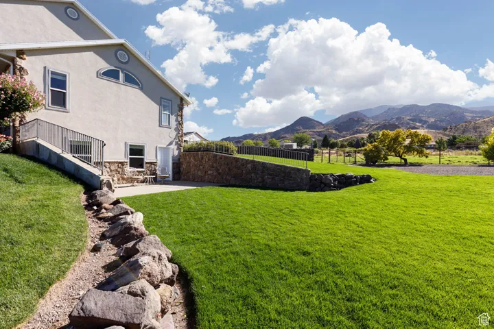 View of yard with a patio area and a mountain view