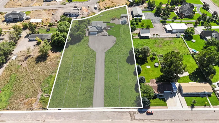 Aerial perspective of suburban area featuring property boundaries highlighted