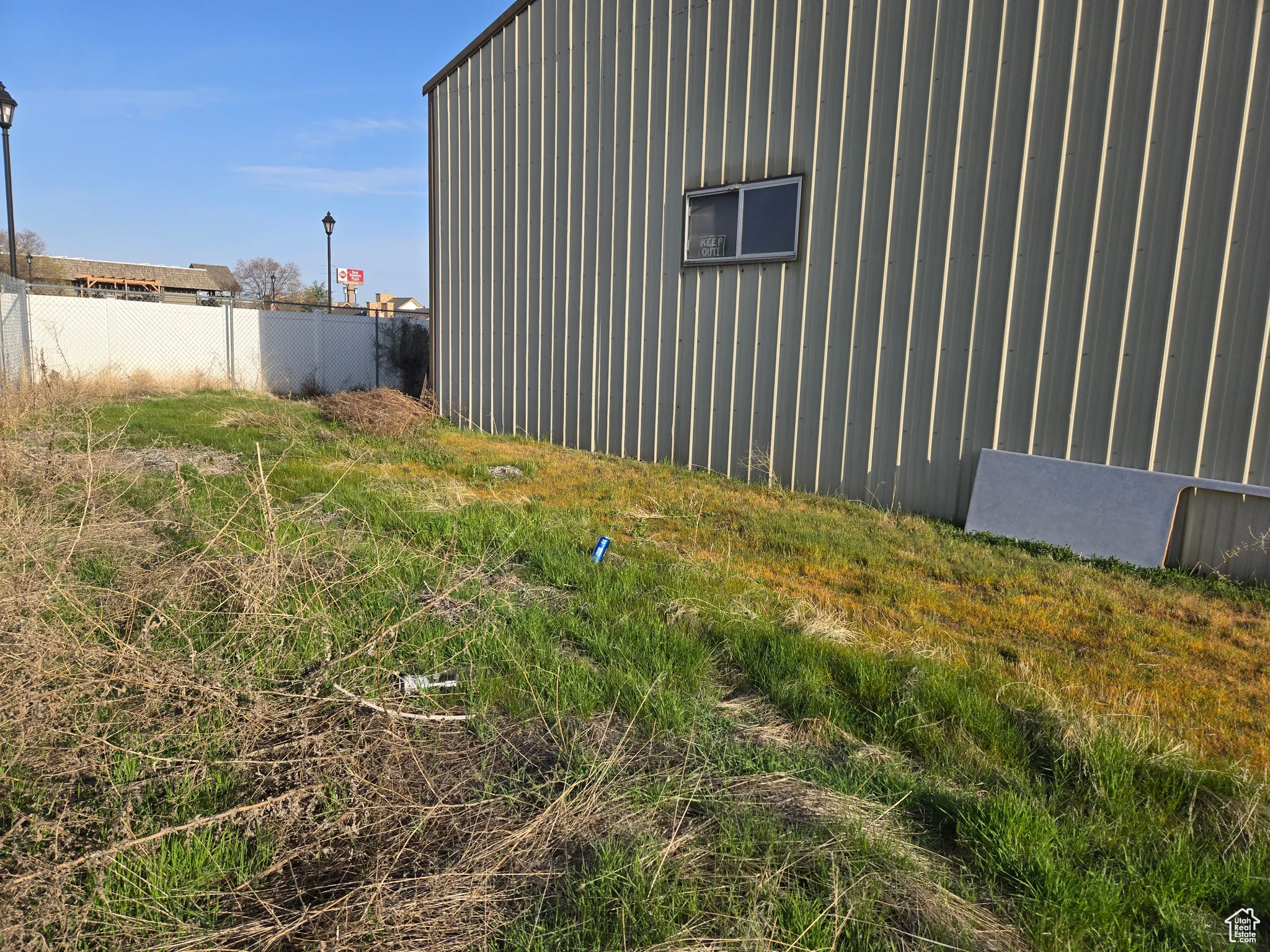 View of home's exterior with fence