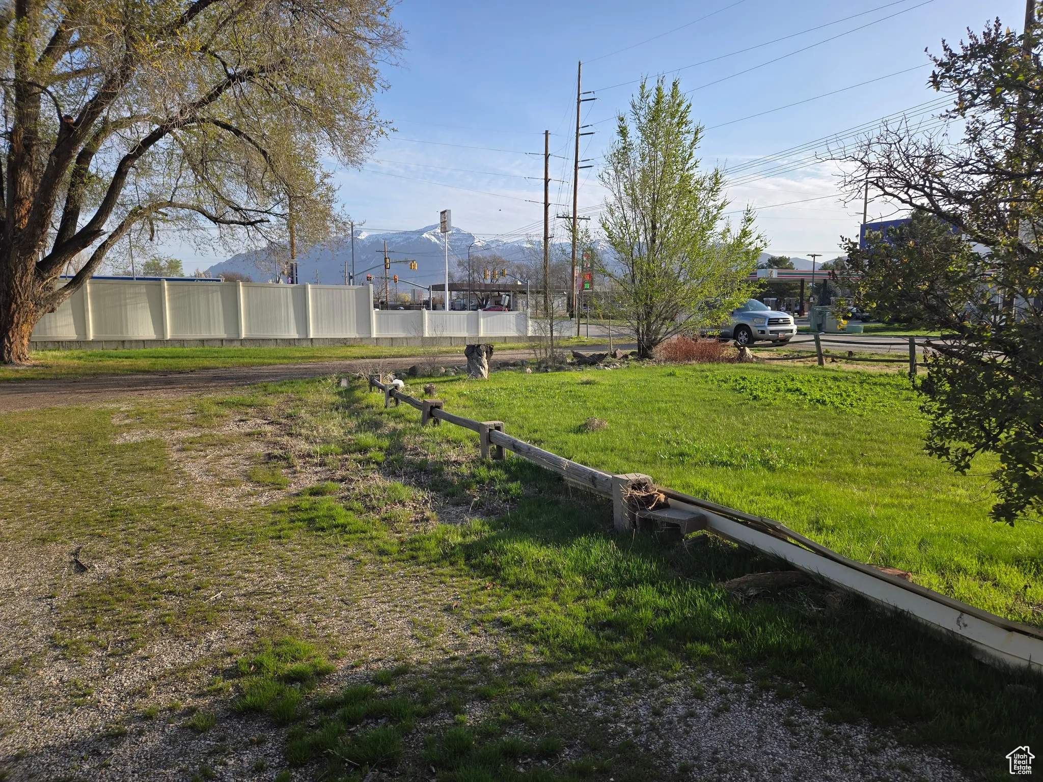 View of yard with a mountain view and fence
