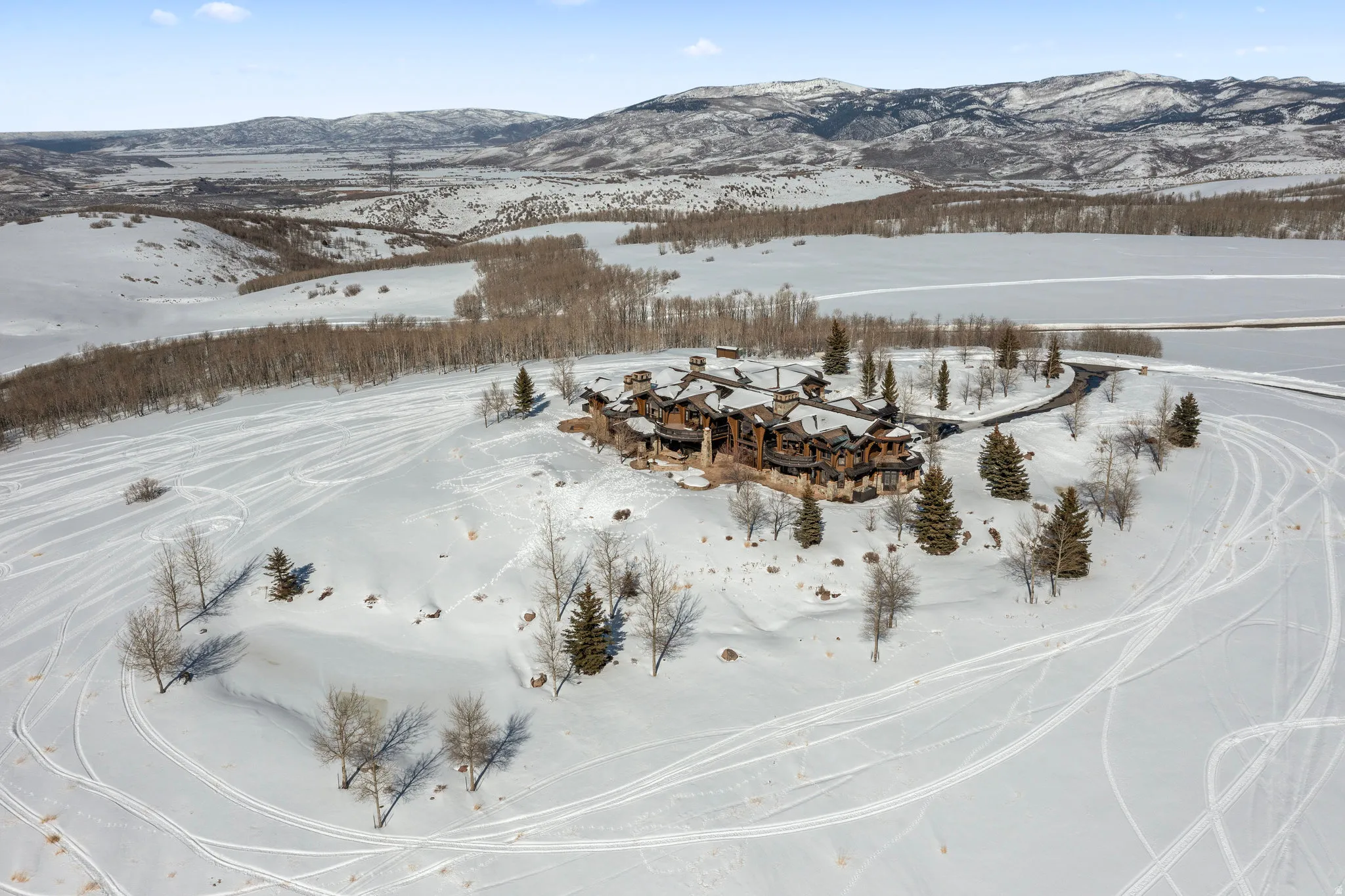 Snowy aerial view featuring a mountain view