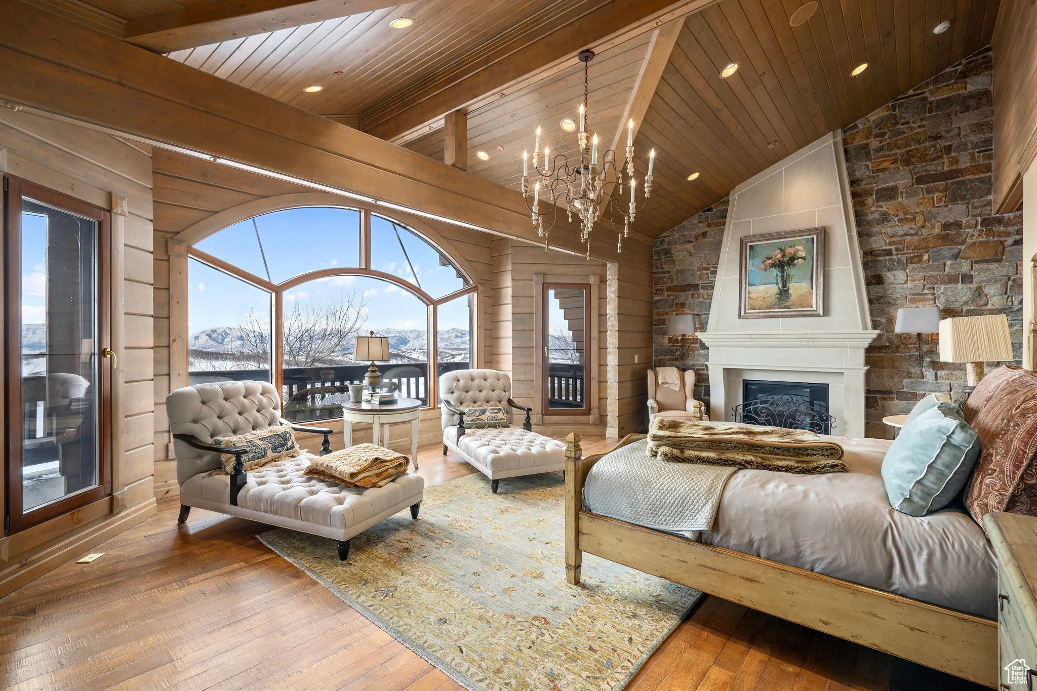 Living room with high vaulted ceiling, a fireplace, wood-type flooring, and wood ceiling
