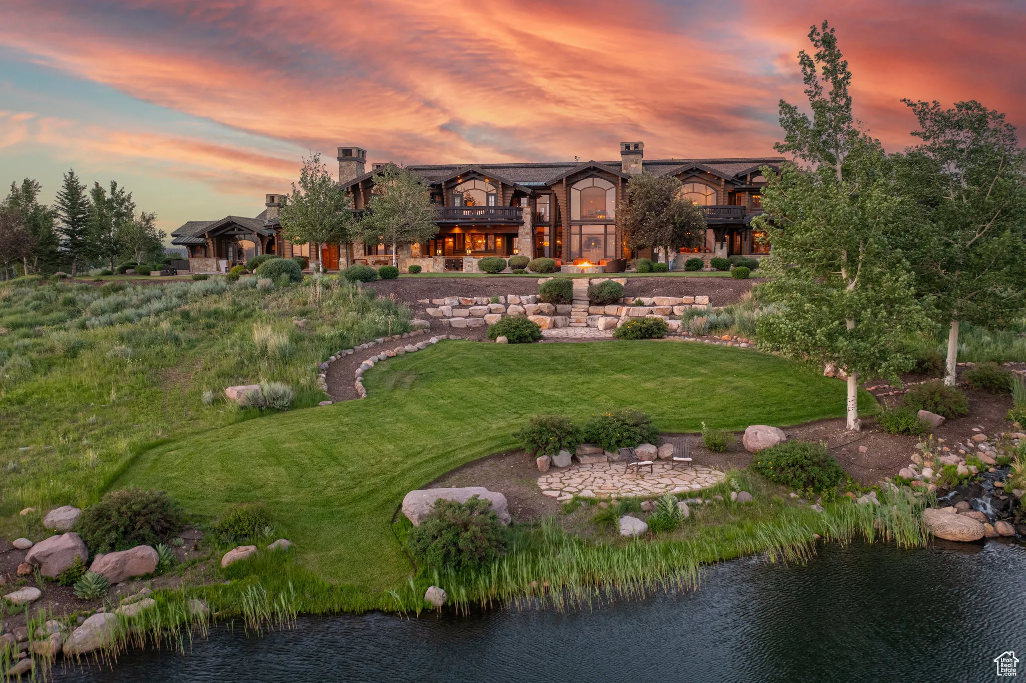 View of home's community featuring a lawn and a water view
