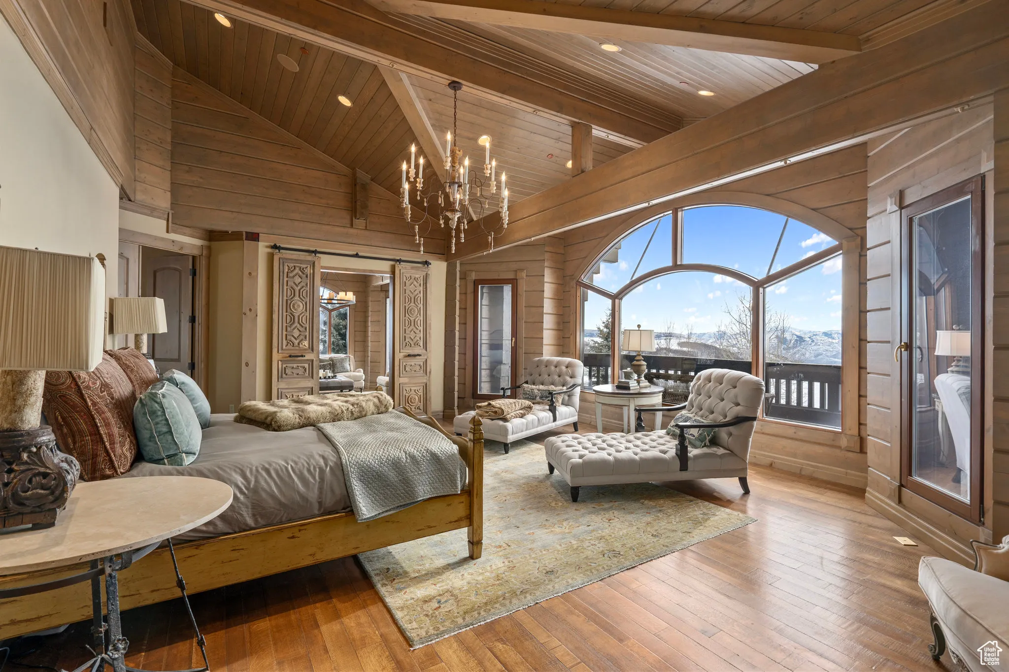 Bedroom featuring a chandelier, access to outside, hardwood / wood-style floors, and wood ceiling