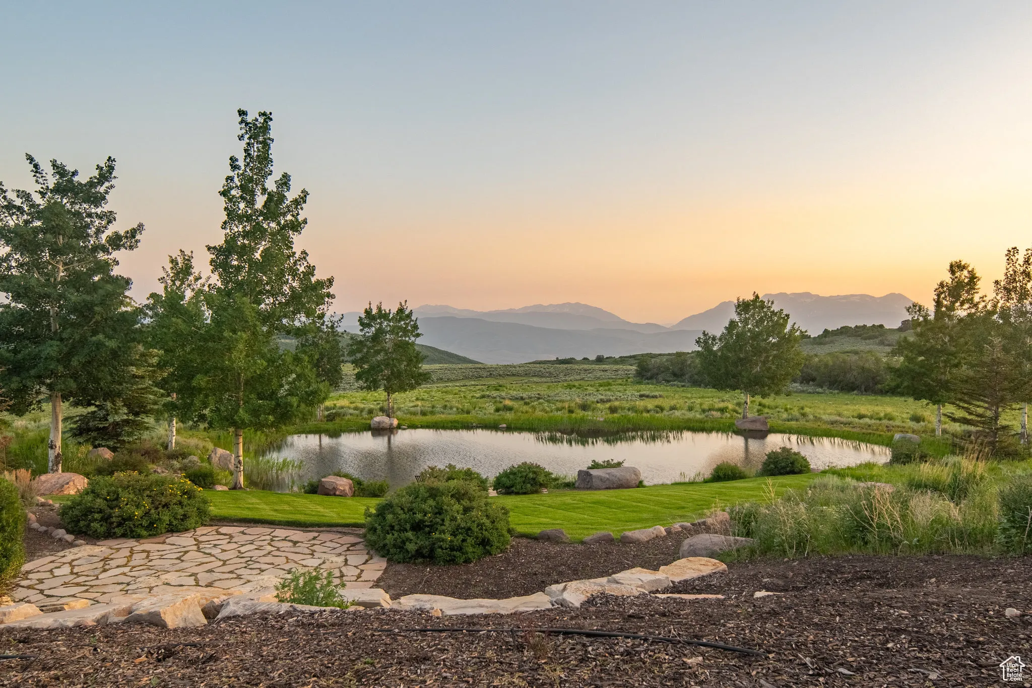 View of mountain backdrop featuring a large body of water
