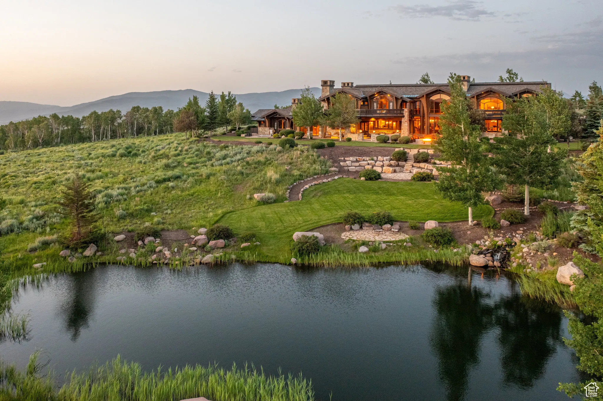 Aerial view at dusk of a water and mountain view