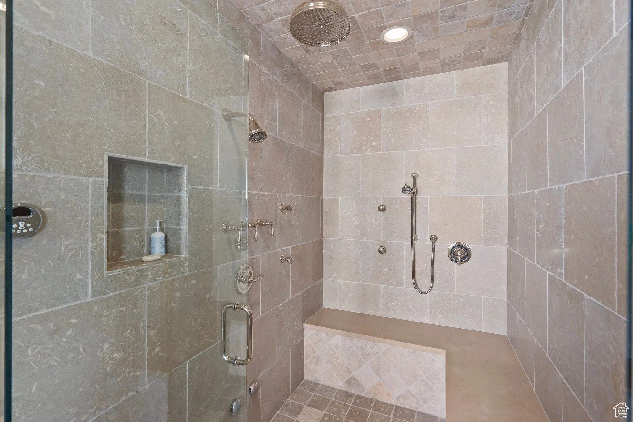 Full bath with a shower stall