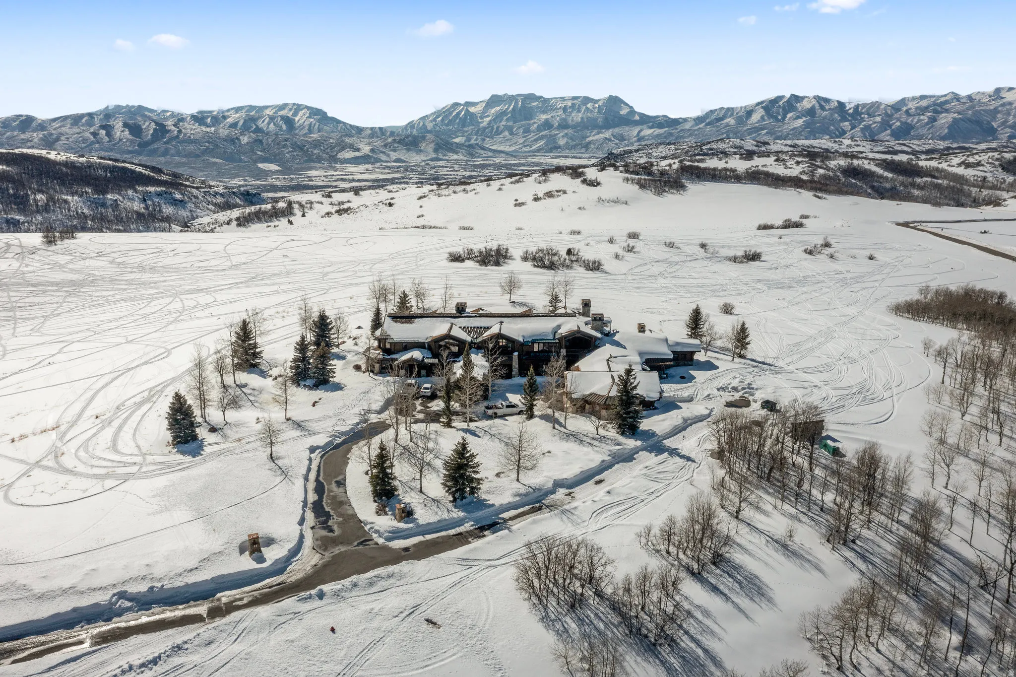Snowy aerial view with a mountain view