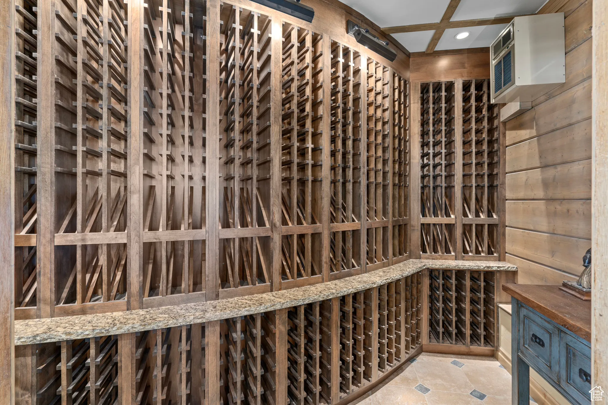 Wine area with recessed lighting and wooden walls