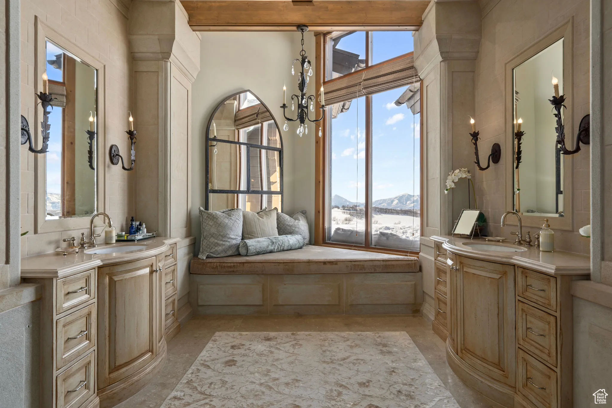 Full bath featuring two vanities, a sink, and a mountain view