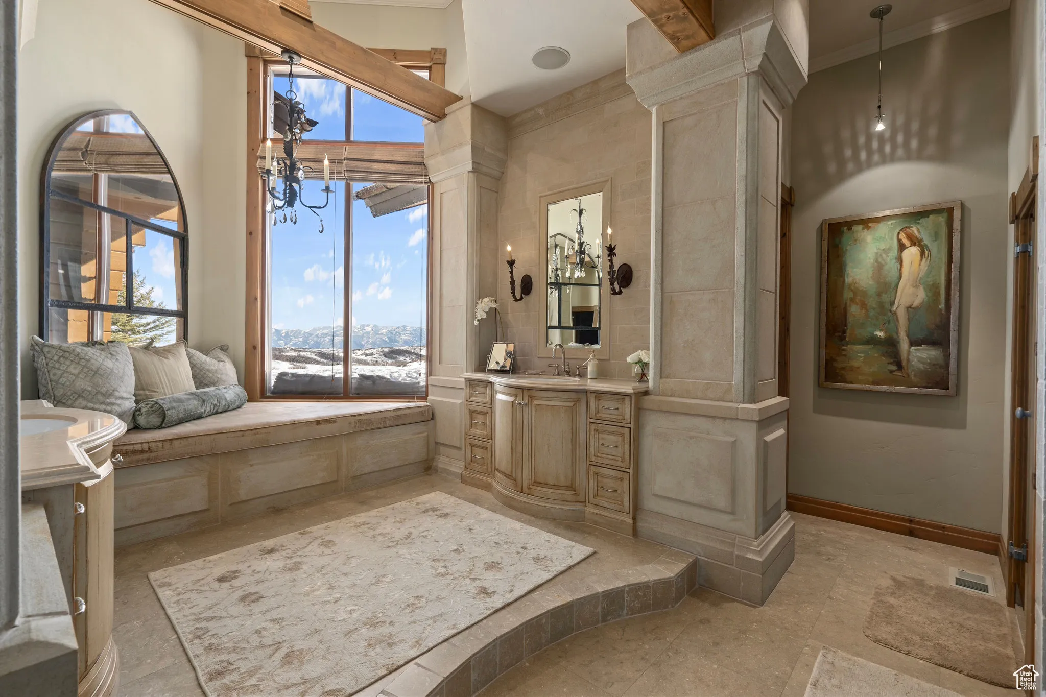 Bathroom featuring visible vents, vanity, baseboards, decorative columns, and crown molding