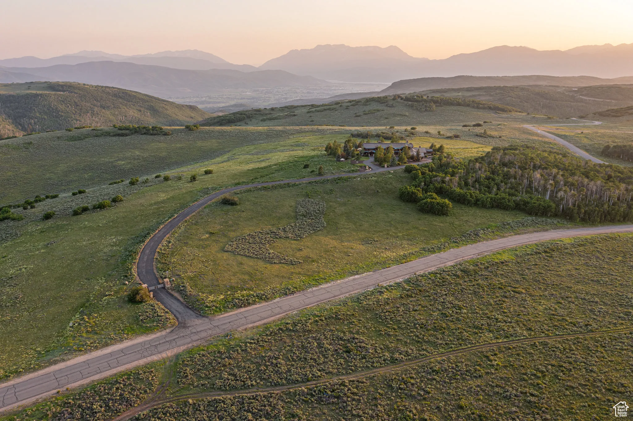 Aerial view at dusk of a mountain view and a view of countryside