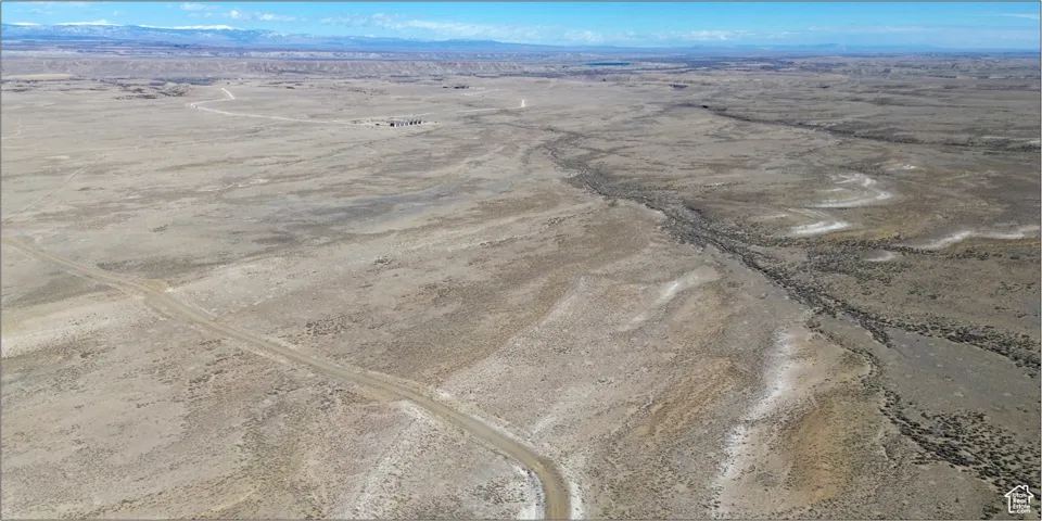 Drone / aerial view with a rural view, a desert view, and a mountain view