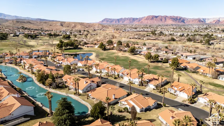 Birds eye view of property featuring a residential view, view of golf course, and a water and mountain view