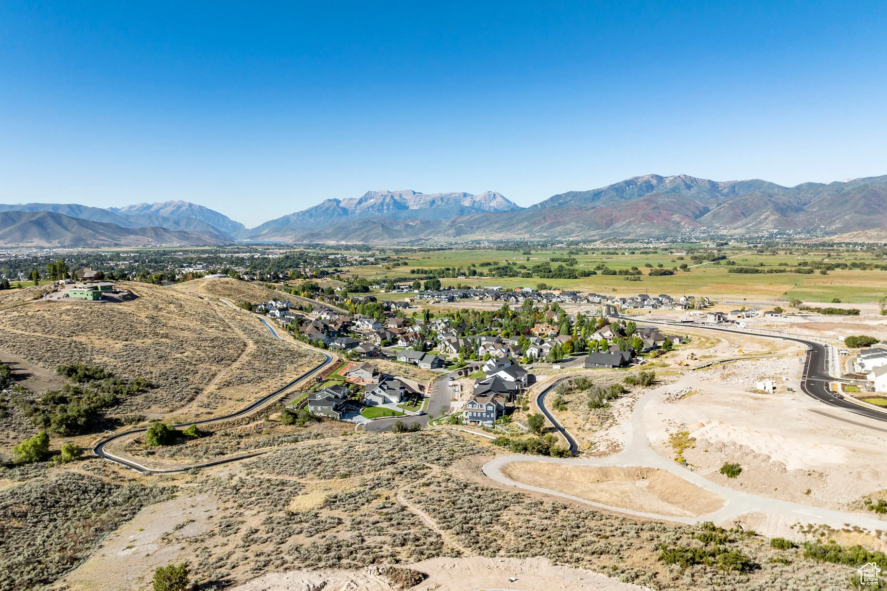 Birds eye view of property with a mountain view