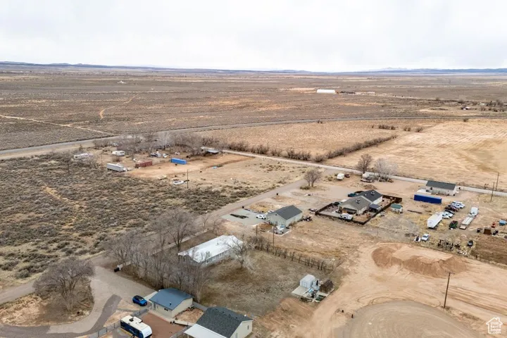 Birds eye view of property with a rural view and view of desert
