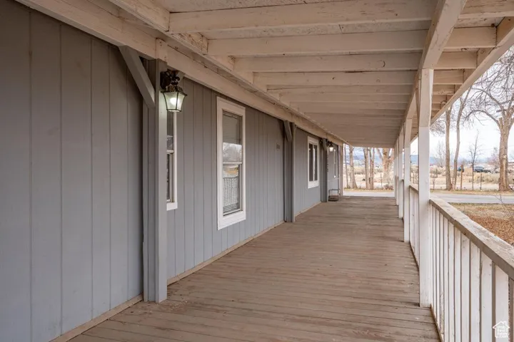 Wooden deck featuring covered porch