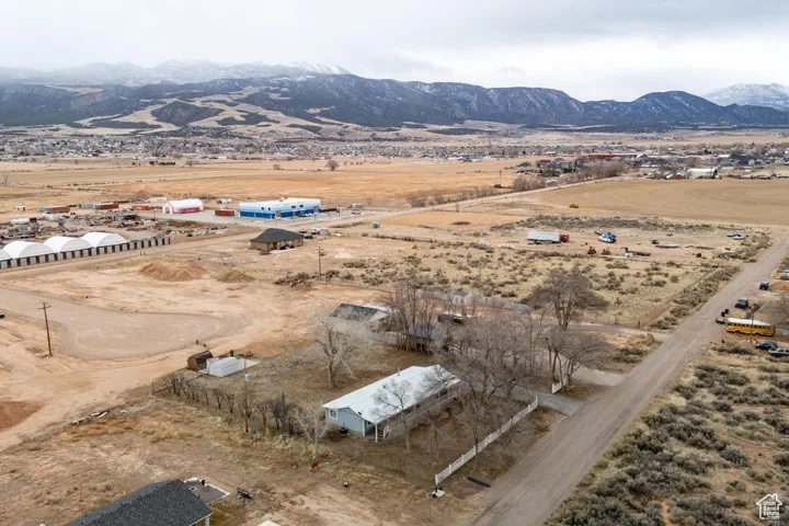 Birds eye view of property with a mountain view, a desert view, and a rural view