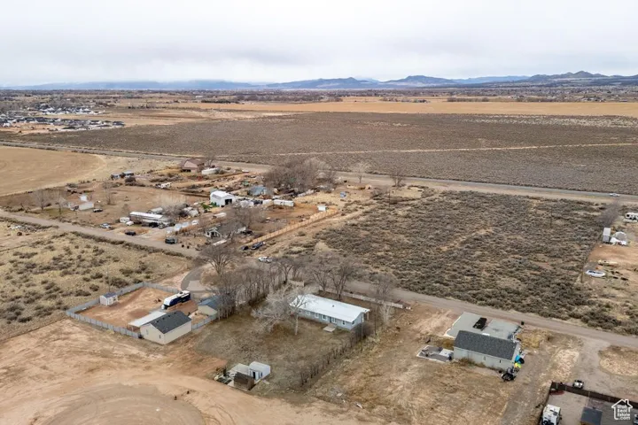 Birds eye view of property featuring view of desert, a rural view, and a mountain view