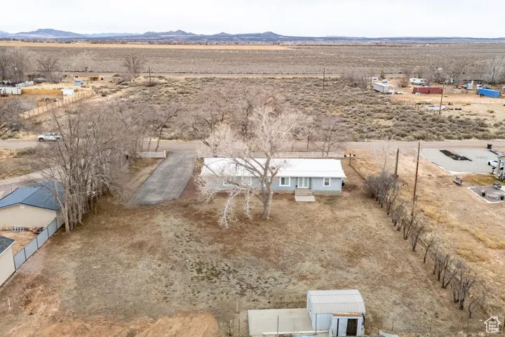Drone / aerial view with a rural view, a desert view, and a mountain view