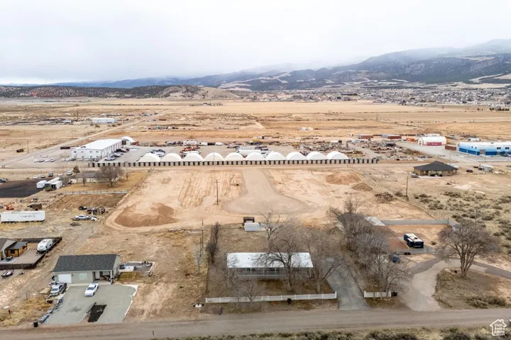 Birds eye view of property with view of desert and a mountain view