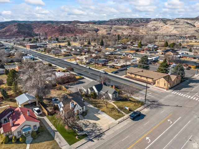 Birds eye view of property with a mountain view and a residential view