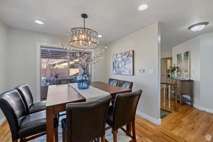 Dining space featuring recessed lighting, a chandelier and covered patio access