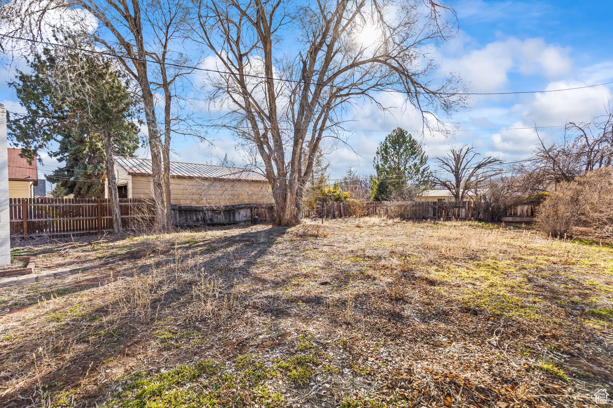 View of yard featuring fence