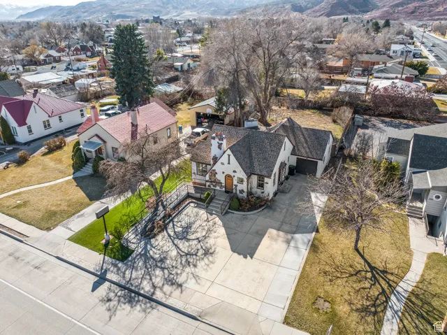 Birds eye view of property featuring a mountain view and a residential view
