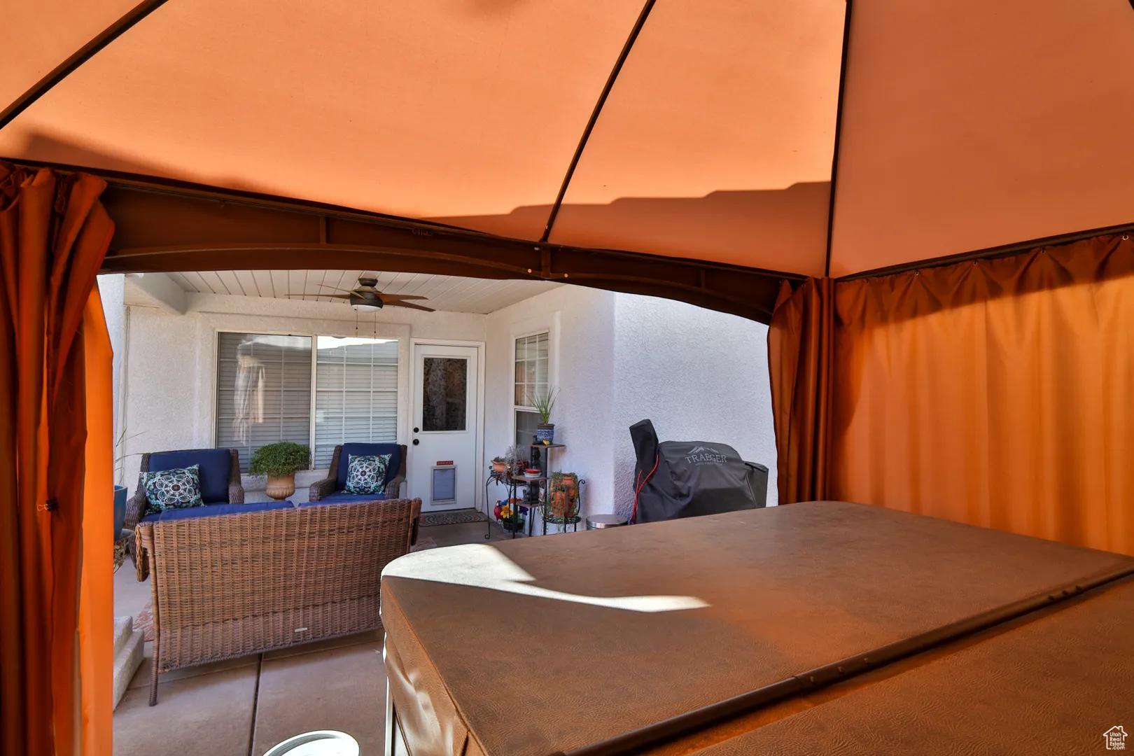View of patio with a ceiling fan