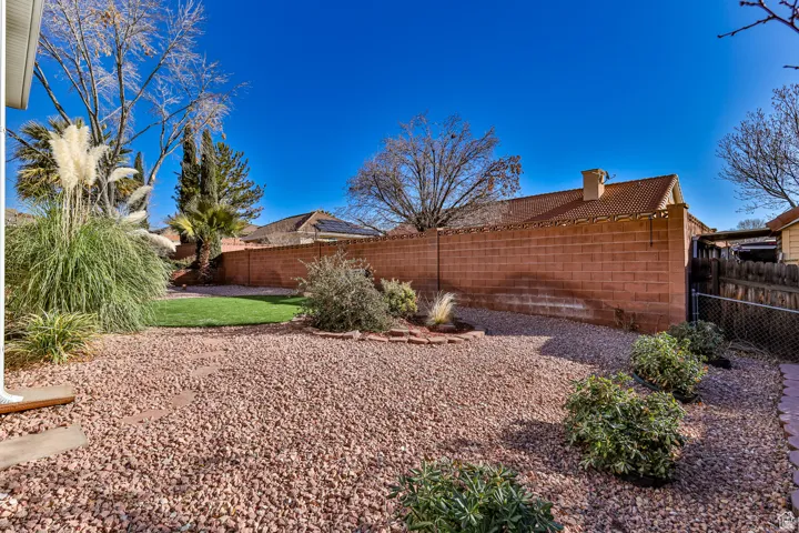 View of yard with a fenced backyard
