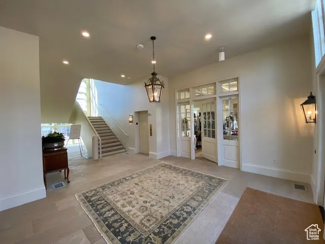 Entryway featuring stairway, recessed lighting, and baseboards