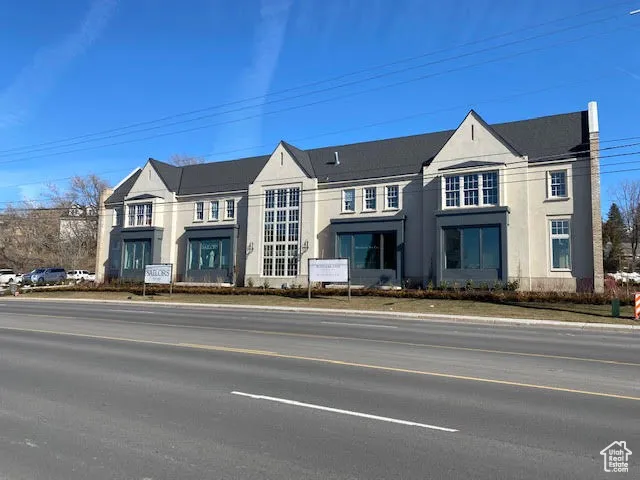 View of front facade featuring stucco siding