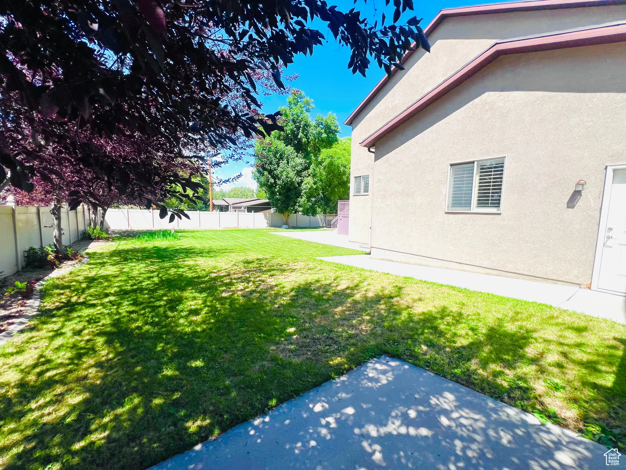 Fenced backyard featuring a patio area