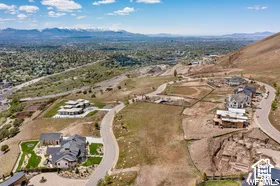 Birds eye view of property with a mountain view