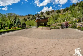 View of community with decorative driveway