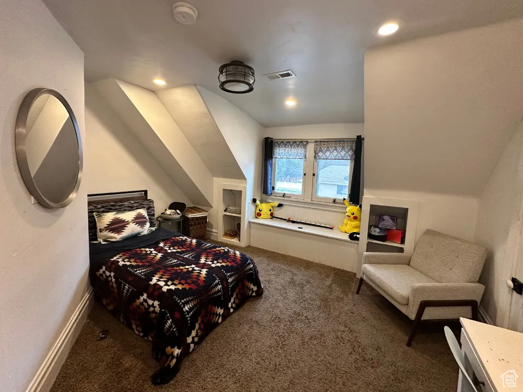 Bedroom with visible vents, baseboards, carpet, vaulted ceiling, and recessed lighting