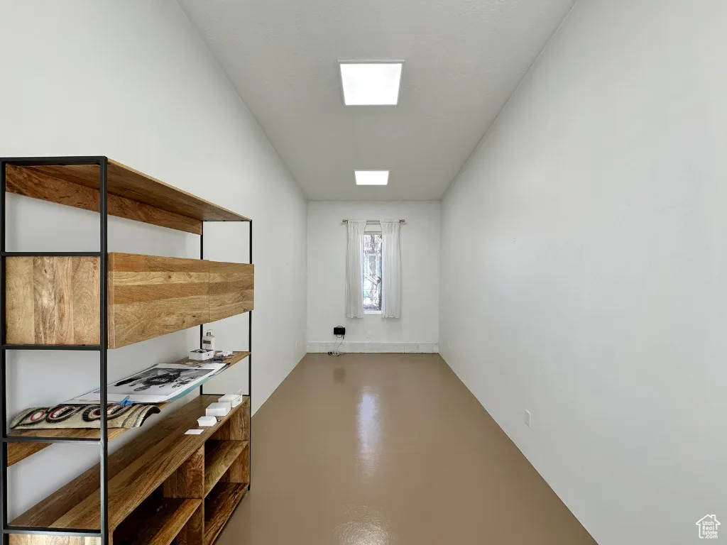 Interior space with a skylight and finished concrete flooring