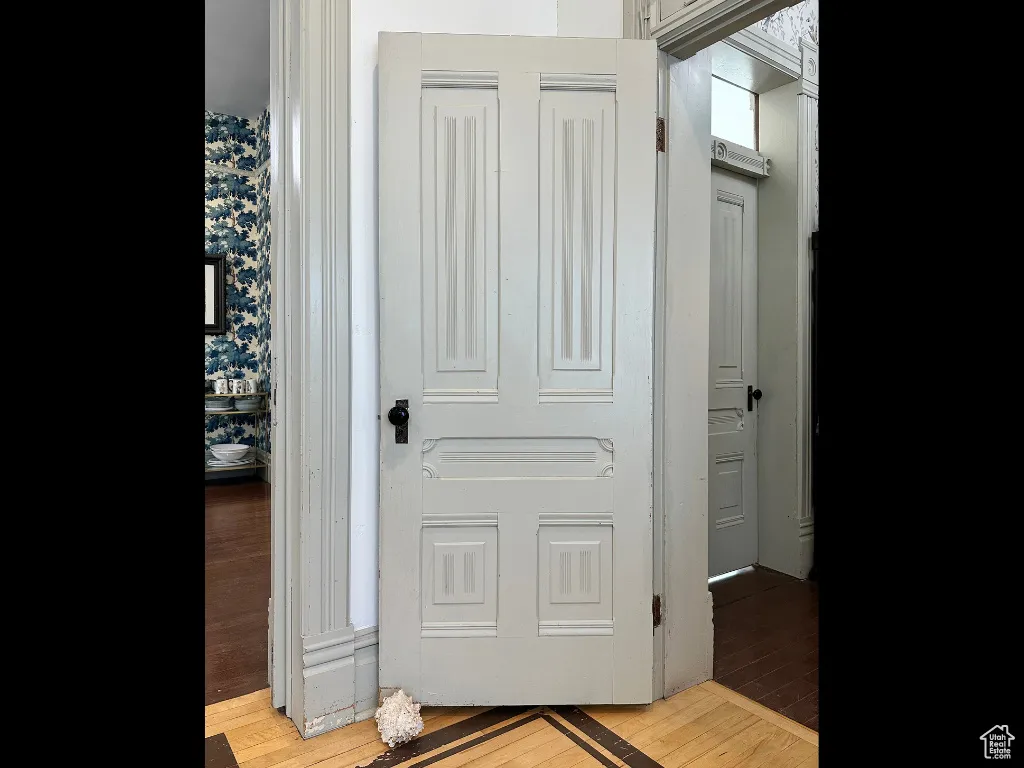 Hall with light wood finished floors