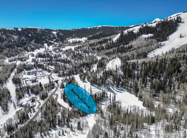 Snowy aerial view featuring a mountain view