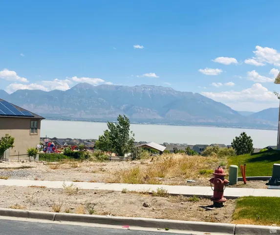 Mountain view featuring a water view