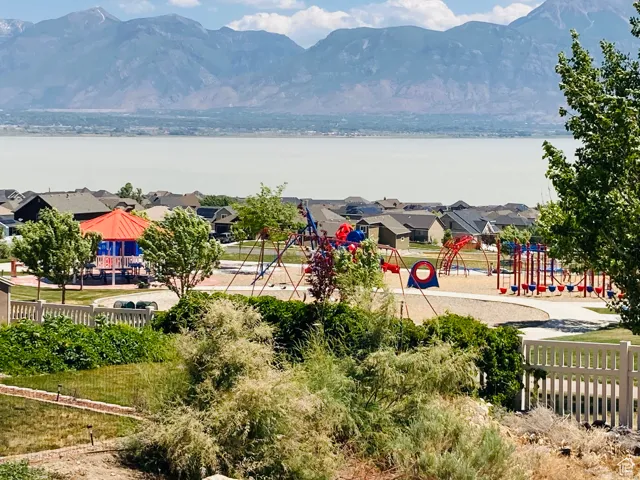View of mountain feature with a residential view and a water view