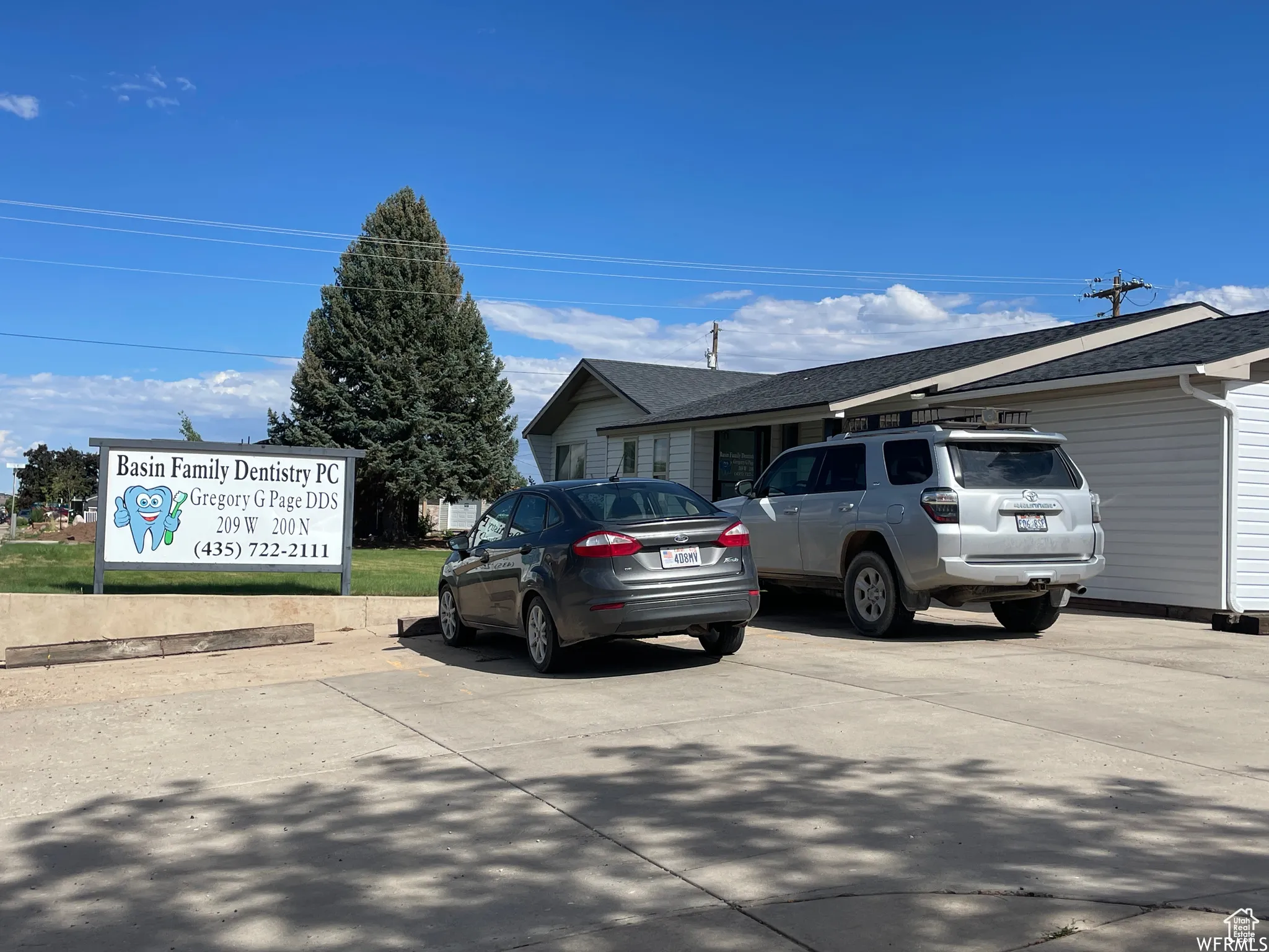 View of side of property featuring roof with shingles